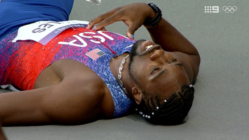 Noah Lyles falls to the ground after Mens 200m loss