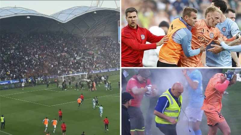 Melbourne Derby abandoned after fans storm pitch and attack players