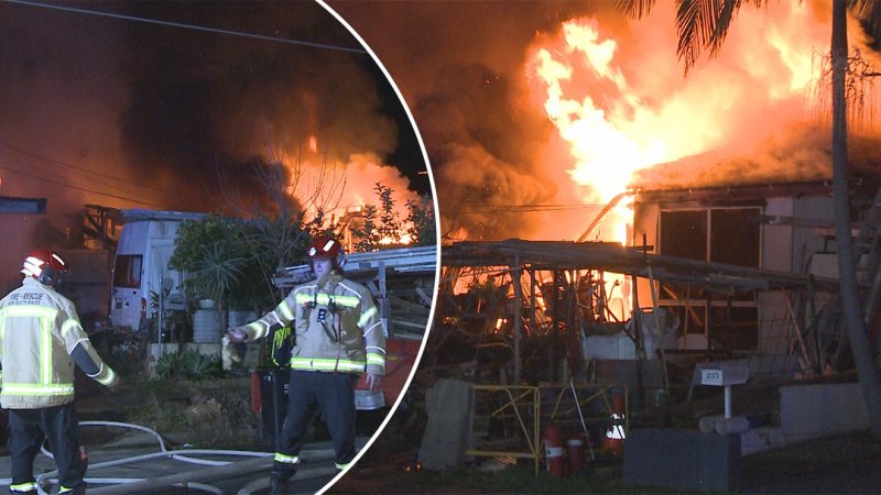 Neighbour charged with assault as Sydney home goes up in flames