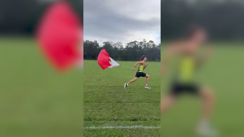 Daniel Williams, Australian 800-metre runner, trains with a parachute