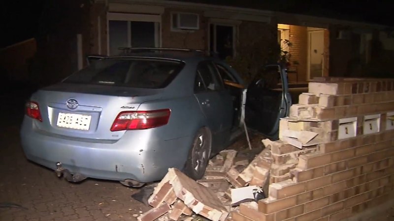 Chaos on Adelaide street after driver crashes into parked car