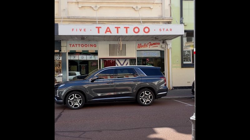 Local tattoo shop bracing for long night as Dockers fans chase inaugural premiership ink