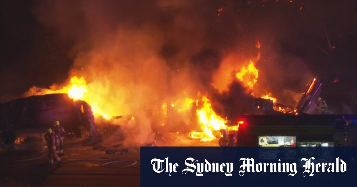 Two road workers injured in collision of a fiery truck