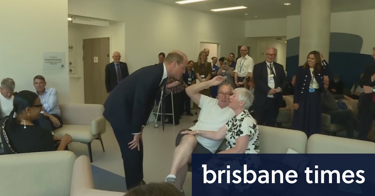 Prince William laughs with outpatient at new cancer centre