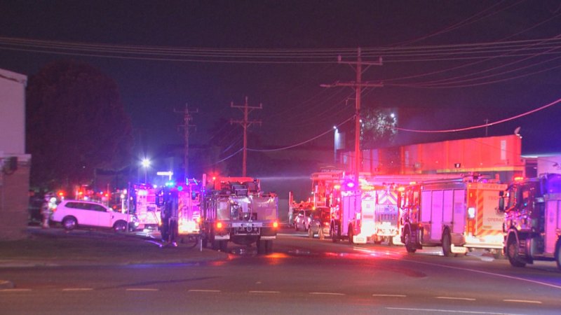 Fierce blaze after car crashes into Melbourne business