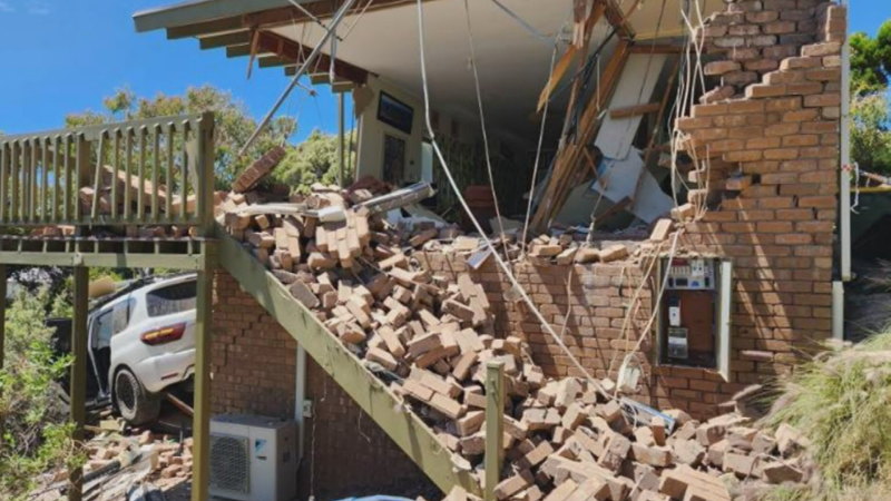 4WD crashes through top of house