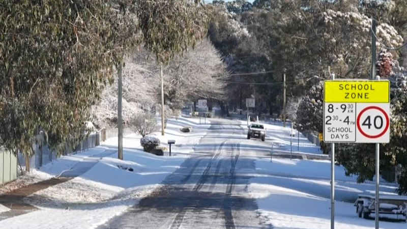 Snow descends on NSW after cold front