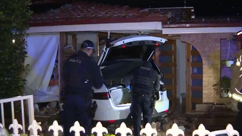 Lucky escape as Porsche crashes through Sydney house, lands in child's bedroom