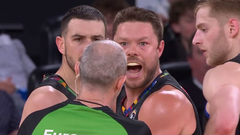 Melbourne United’s Chris Goulding clashes with Melbourne Phoenix centre Jordan Hunter