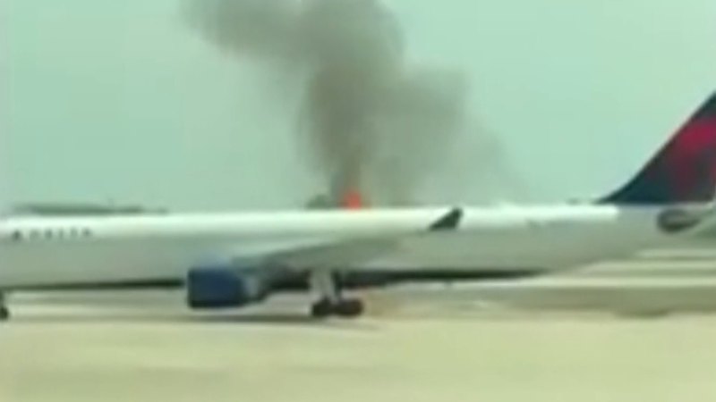 Passengers evacuate on tarmac after engine fire