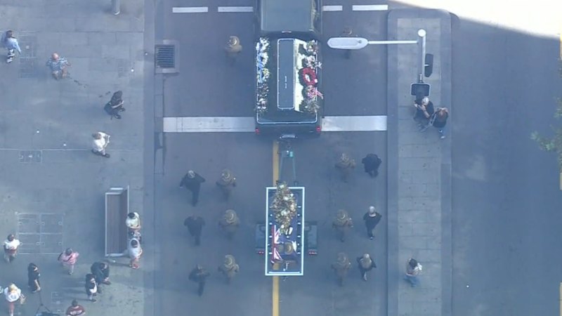 Thousands join military procession for funeral of Western Australia's last WWII POW