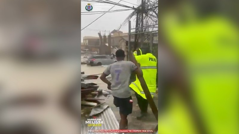 Jamaican police survey damage from Hurricane Melissa