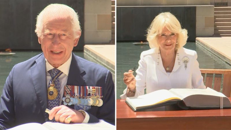 King Charles and Queen Camilla sign visitors book at the Australian War Memorial