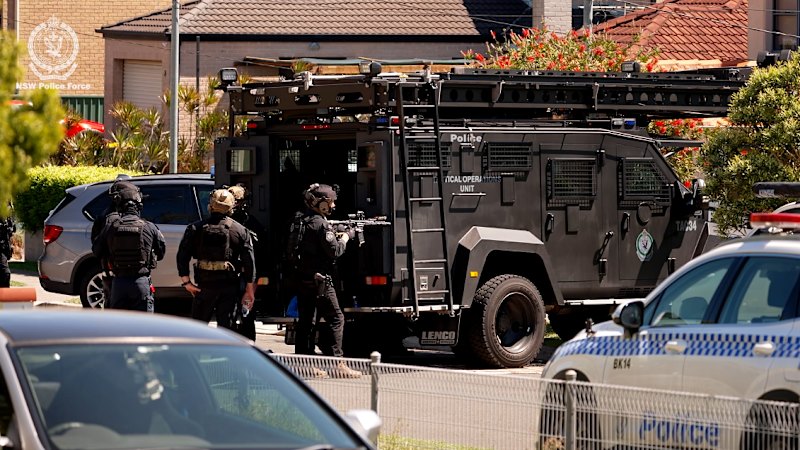 Watch: Armored officers blast warnings, circle Panania house during police operation