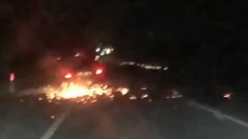 Terrifying moment stolen car catches on fire, explodes on road