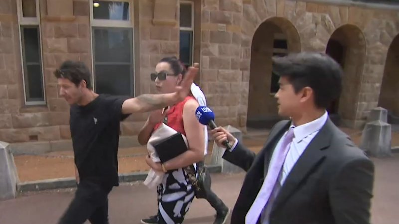 Supporters lash out at cameras outside court