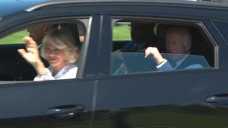 Cheers erupt as King Charles’ convoy passes by