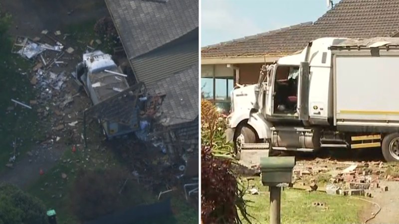 Two dead after truck crashes into home