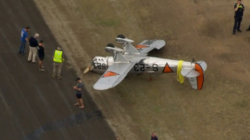 Vintage plane flips after landing, pilot hospitalised