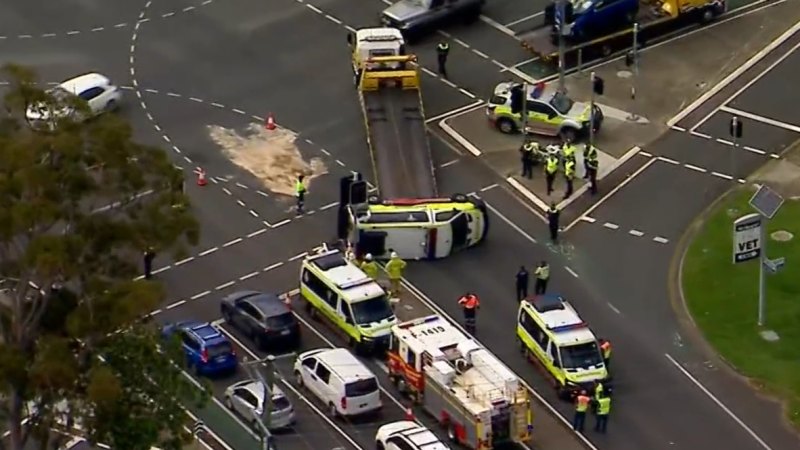 Four injured in ambulance rollover in Brisbane