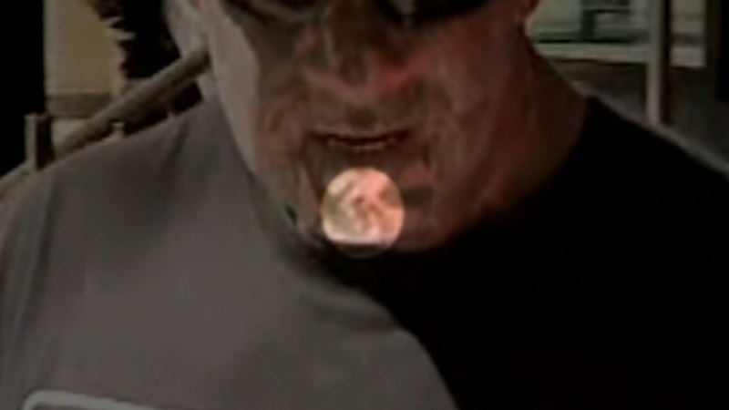 Former bikie charged with showing swastika tattoo in public
