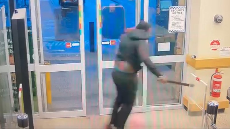 CCTV captures man threatening staff with machete at Fawkner Dan Murphy's