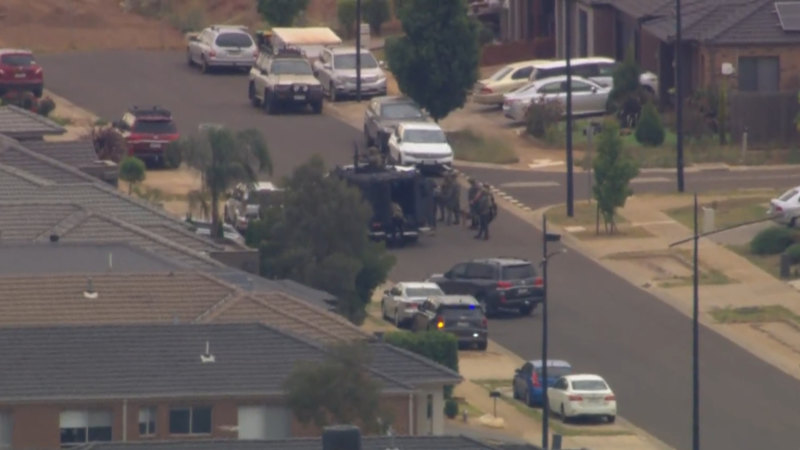 Man who allegedly shot at police arrested after heavily armed officers swarm Melbourne home