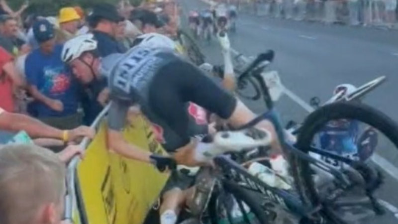 Woman hospitalised after cyclists crash into crowd of spectators