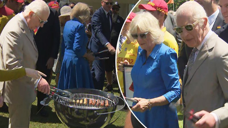 King Charles and Queen Camilla turn sausages on the barbecue