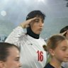 Iranian players salute during anthem ahead of Matildas clash