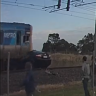 Train ploughs into car stuck on track in Melbourne's north