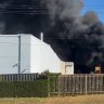 Firefighters are battling a factory fire in Sydney’s southwest