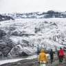 Hikers head towards the Solheimajokull Glacier.