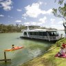 Riverside relaxation: A family picnic on the banks of the Murray River, Mildura.