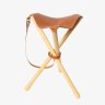 This classic tripod stool folds down.