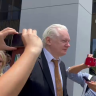 Assange walks out from court a free man