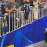 Steph Curry lands a bucket from the tunnel before Golden State's match.