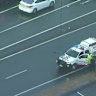 A young boy has suffered serious injuries after he was allegedly struck by a police car outside a Logan school during pick-up.