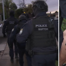 More than a dozen alleged Sydney gang members have faced court after police raids yesterday.