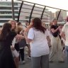 Taylor Swift fans dance outside the MCG