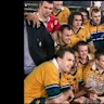 Owen Finegan holds his 2001 Lions series victory above winning the William Webb Ellis trophy in 1999.