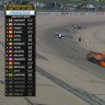 Terrifying moment loose wheel rolls onto race track