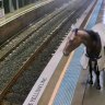 Horse roams around Sydney train station platform.