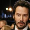 Keanu Reeves discovers intruder sitting in his home library