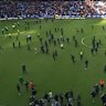 Fans storm pitch after Celtic-Rangers game
