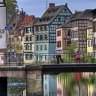 Colorful traditional houses in the 'Petite france' area and their reflections on the river, Strasbourg, Alsace, France. 