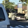 Patrol car destroyed by 'suspicious' fire outside Brisbane police station