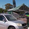 Couple rushed to hospital after barbecue catches alight at Adelaide Bunnings