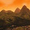 The bright side ... sunset over St Lucia's Pitons.