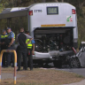 Woman dies in car and bus collision